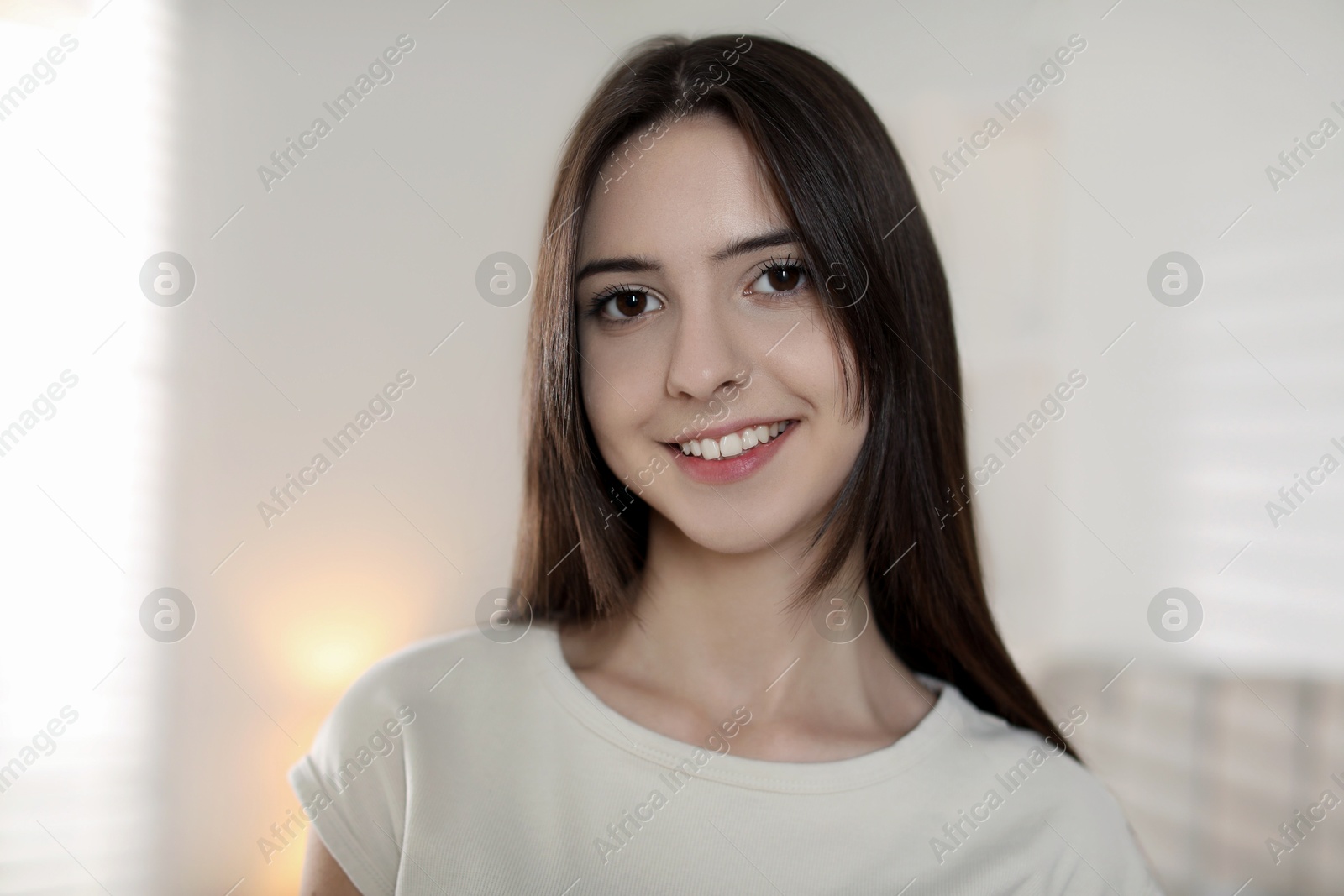 Photo of Portrait of happy teenage girl at home