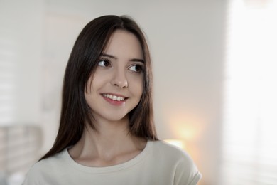 Photo of Portrait of happy teenage girl at home. Space for text