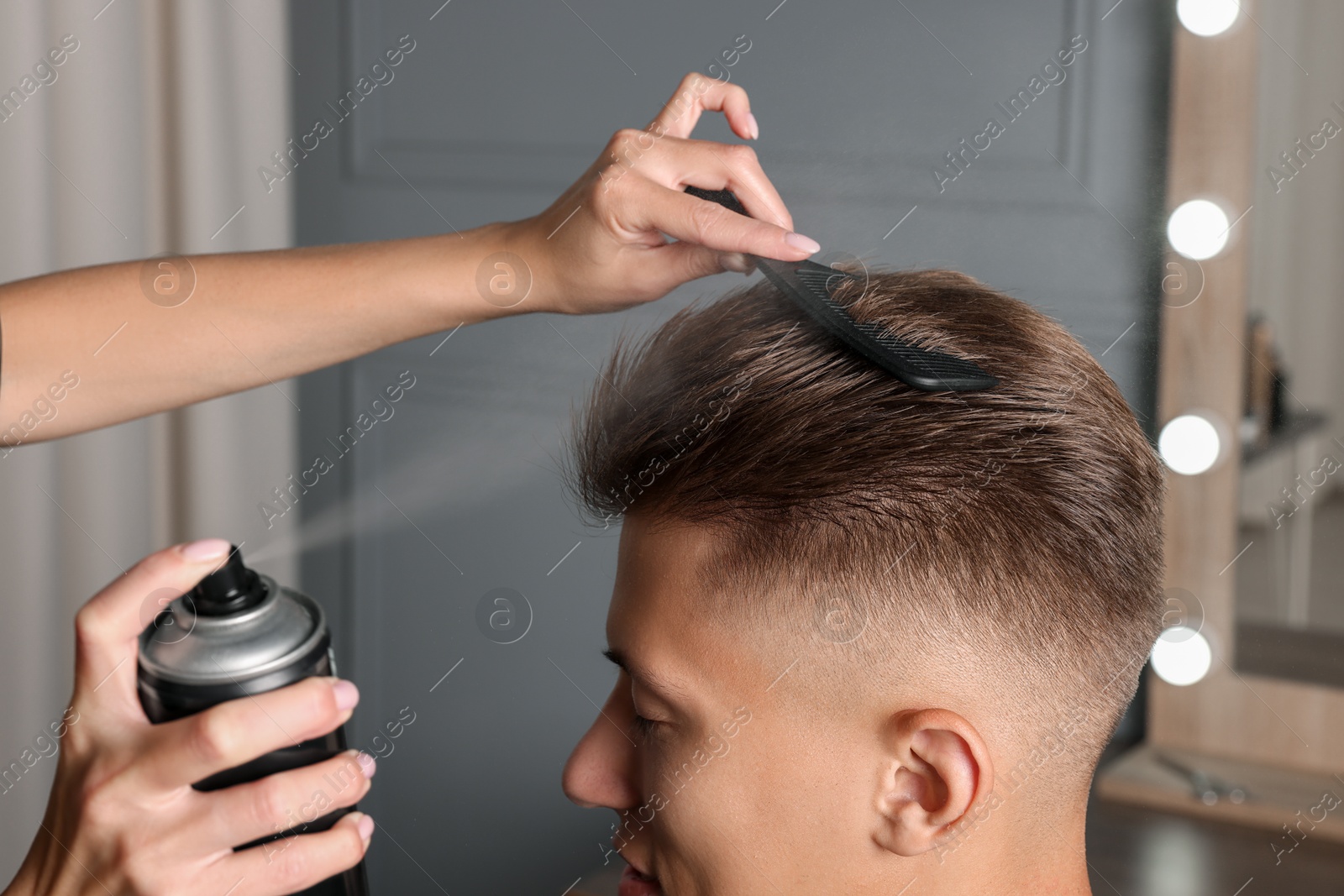 Photo of Hair cutting. Professional hairdresser working with client in barbershop, closeup