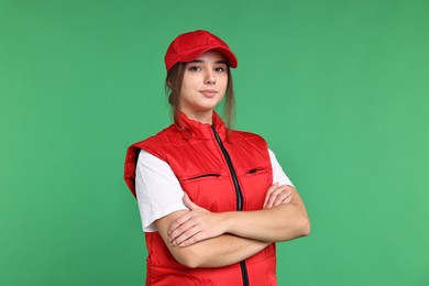 Photo of Girl in uniform on green background. Work for teenagers