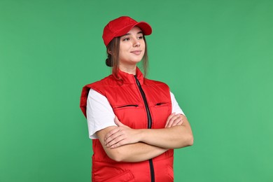 Photo of Girl in uniform on green background. Work for teenagers