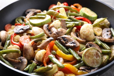 Photo of Different vegetables and mushrooms in frying pan, closeup