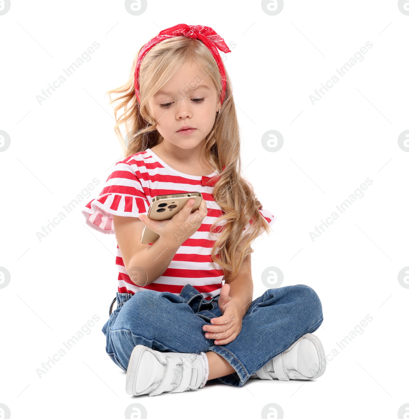 Photo of Cute little girl with smartphone on white background