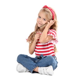 Photo of Cute little girl talking on smartphone against white background