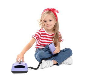 Photo of Cute little girl with telephone on white background