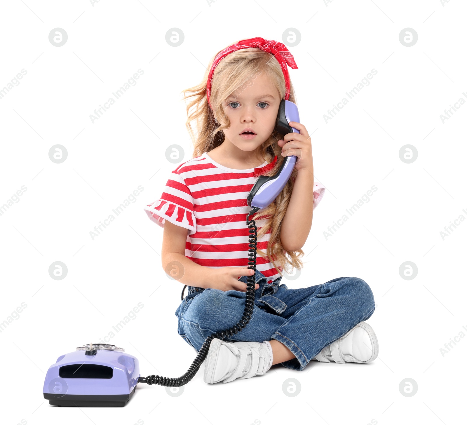 Photo of Cute little girl with telephone on white background