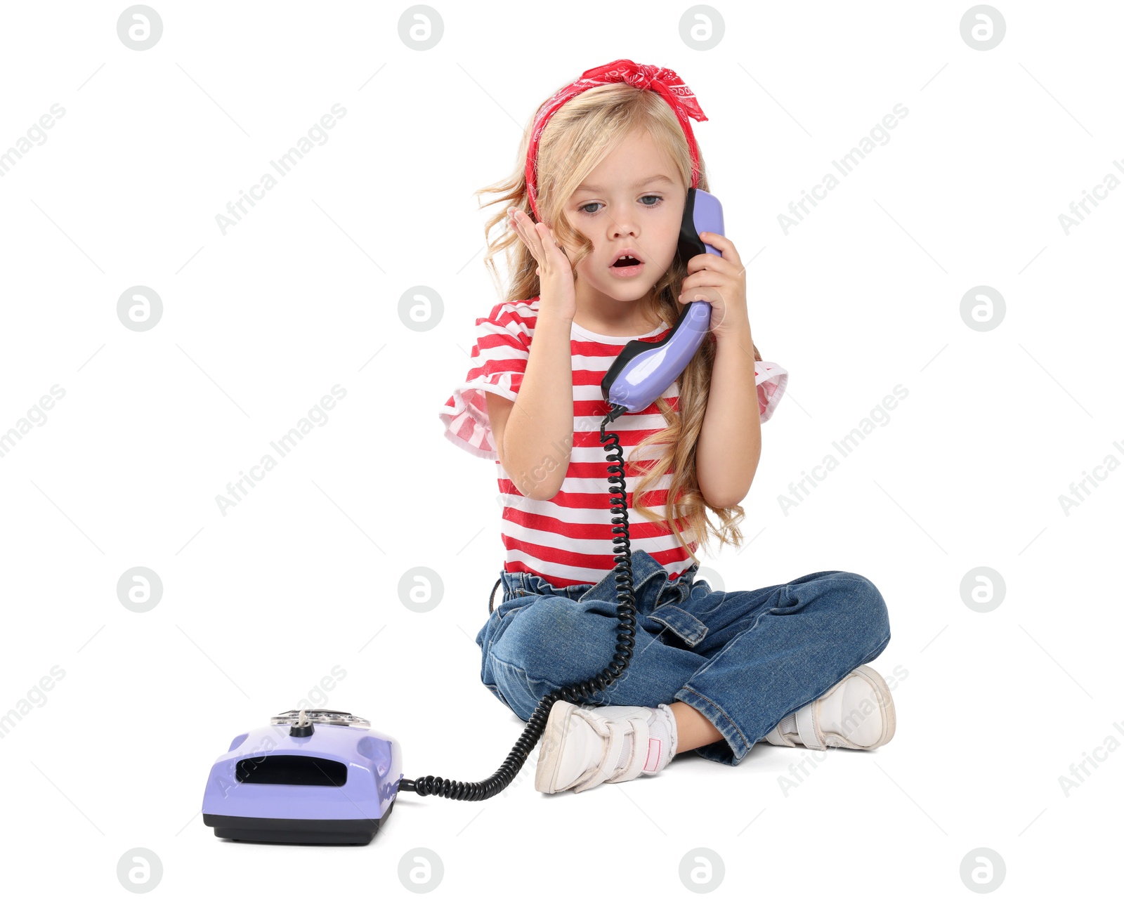 Photo of Cute little girl with telephone on white background