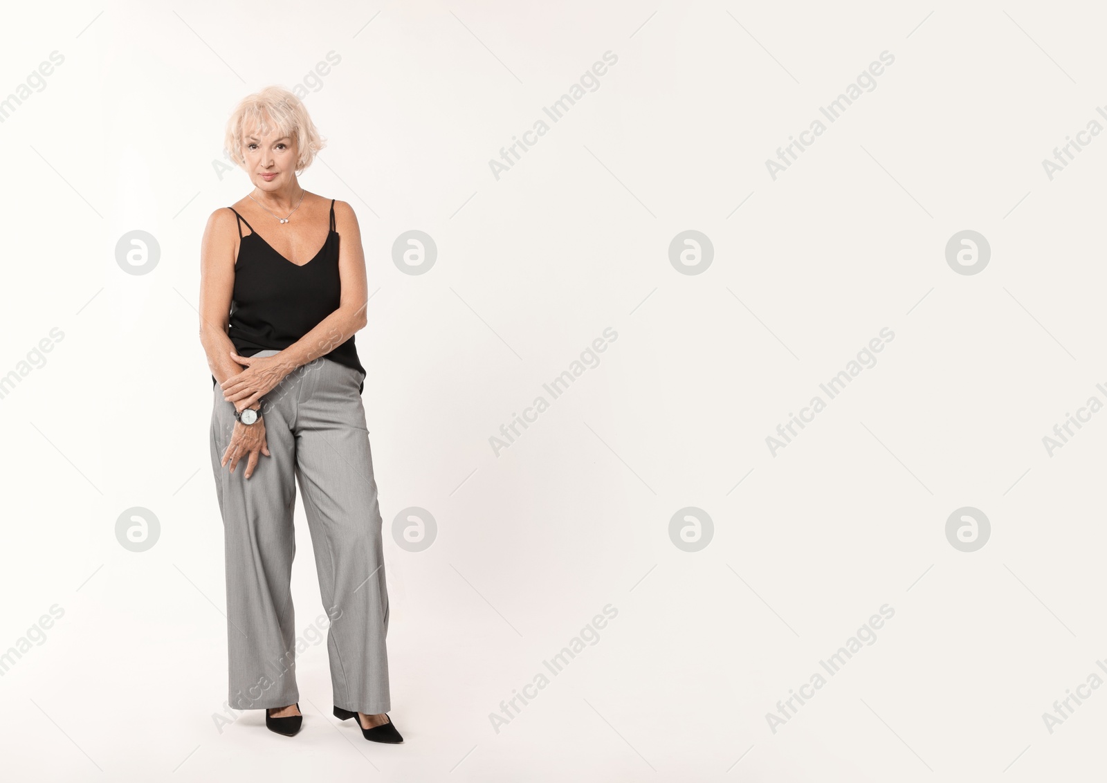 Photo of Full length portrait of beautiful senior woman on white background, space for text