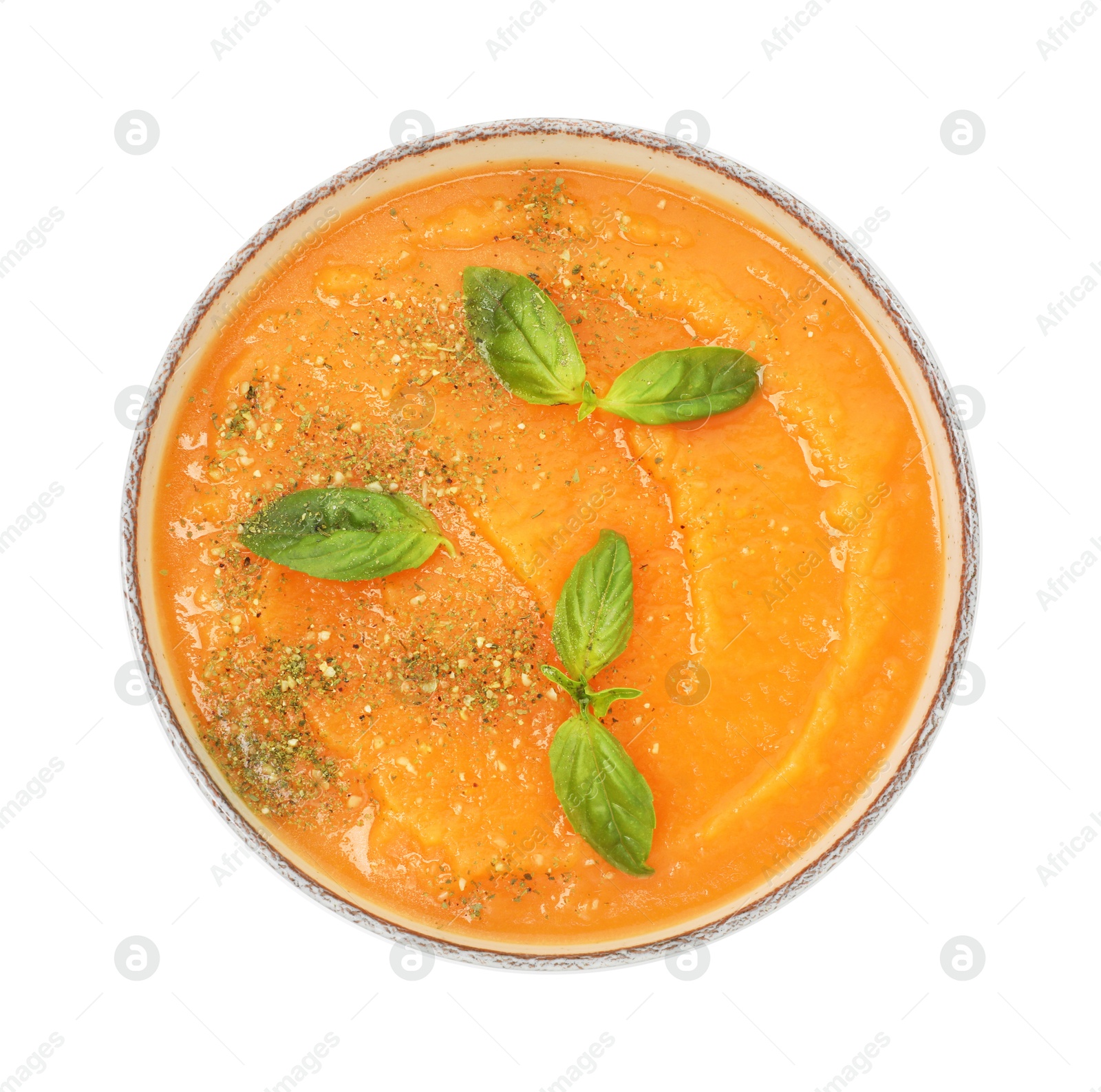 Delicious sweet potato soup with basil in bowl isolated on white, top view Photo of Delicious sweet potato soup with basil in bowl isolated on white, top view