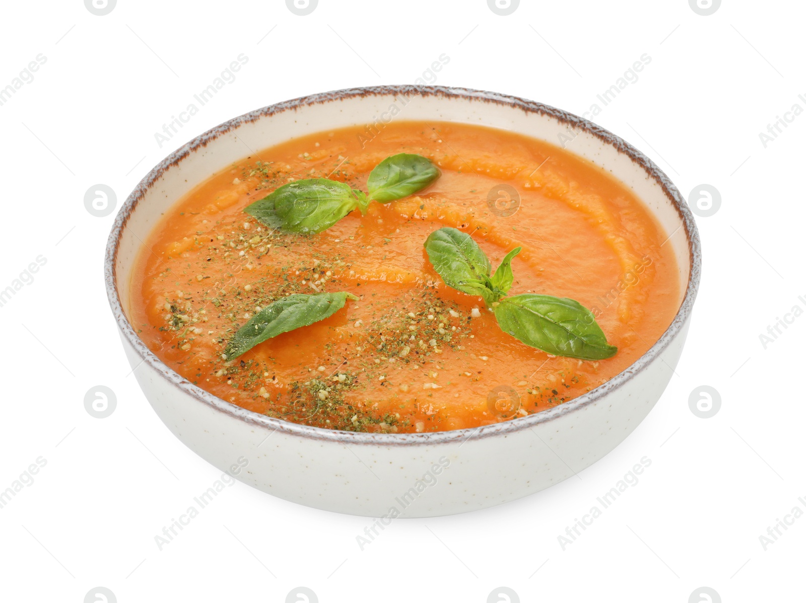 Delicious sweet potato soup with basil in bowl isolated on white Photo of Delicious sweet potato soup with basil in bowl isolated on white