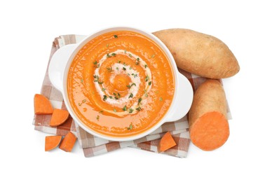 Photo of Delicious sweet potato soup with microgreens and fresh vegetables isolated on white, top view