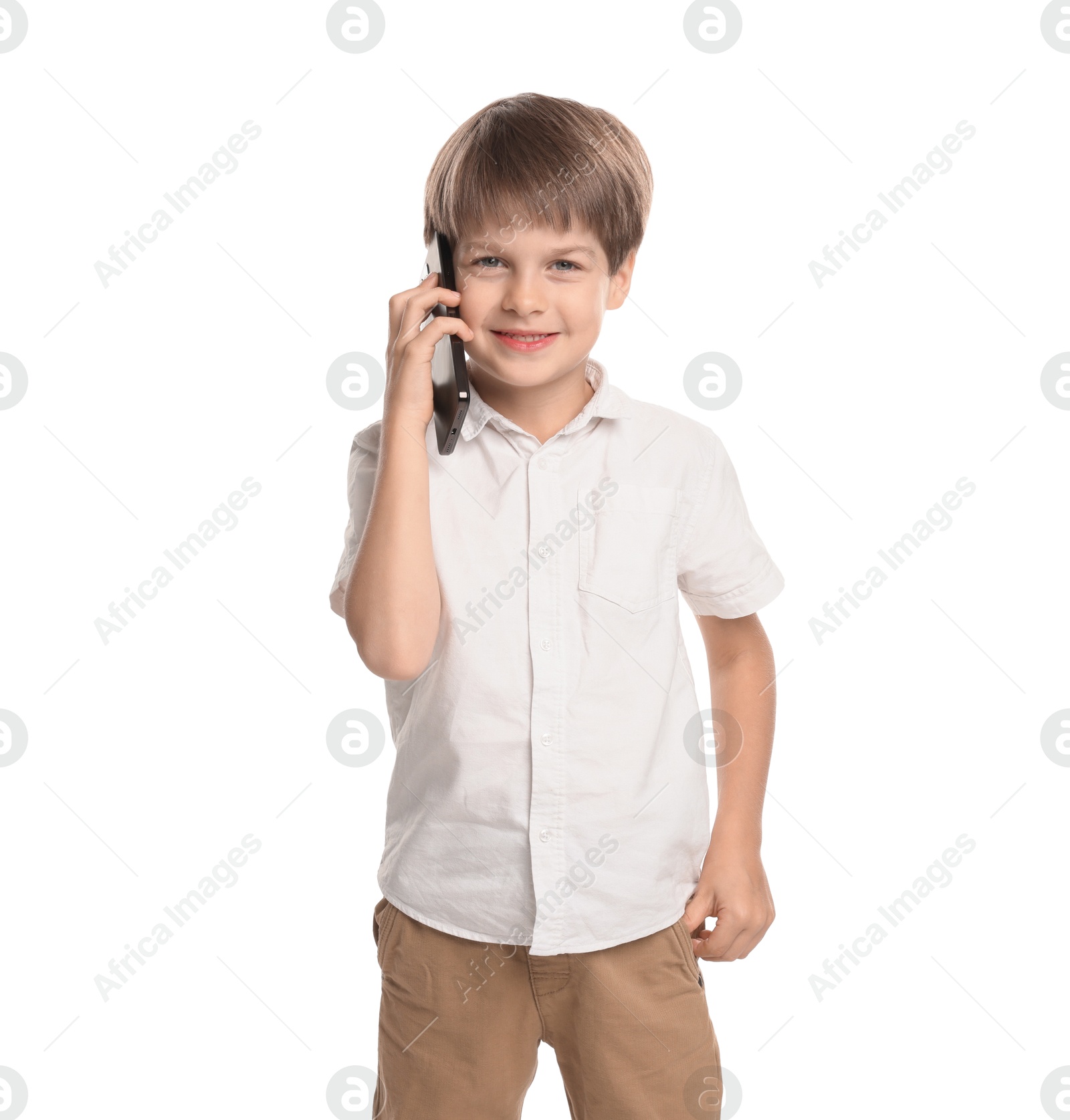 Photo of Cute little boy talking on smartphone against white background