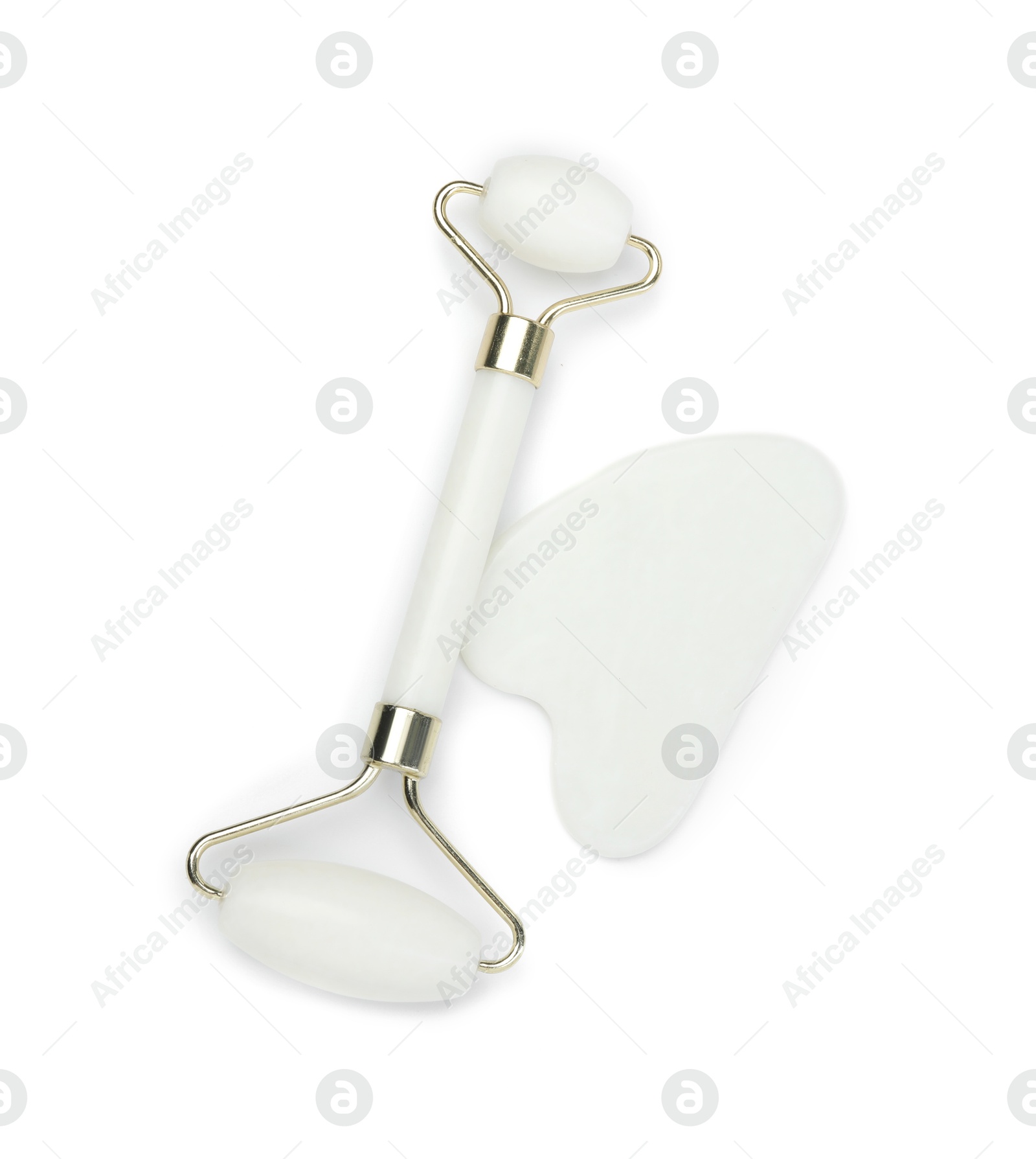 Photo of Face roller and gua sha tool isolated on white, top view