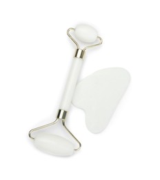 Face roller and gua sha tool isolated on white, top view