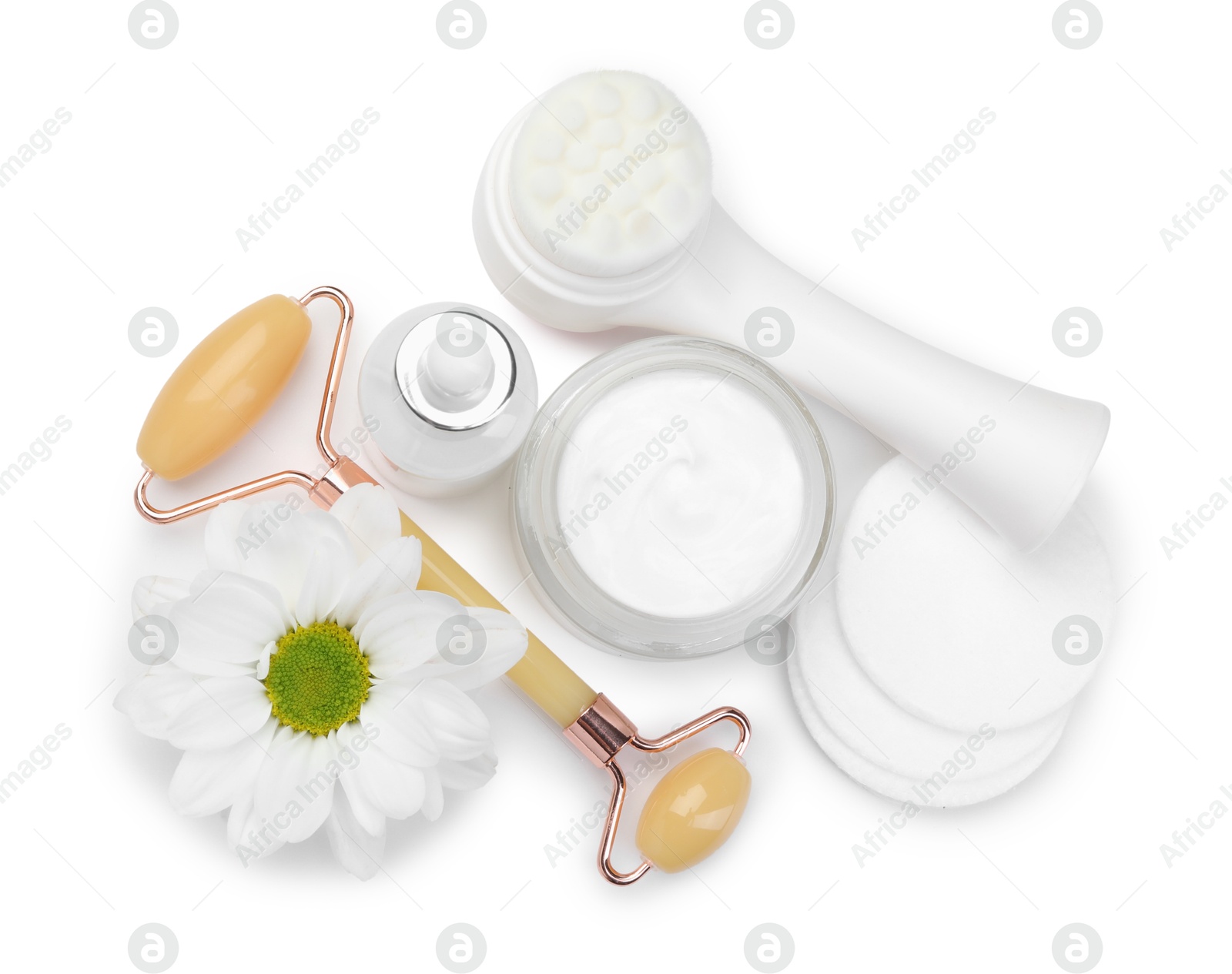 Photo of Face roller, cosmetic products and flower isolated on white, top view