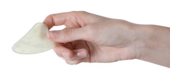 Photo of Woman holding gua sha tool on white background, closeup