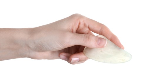 Photo of Woman holding gua sha tool on white background, closeup