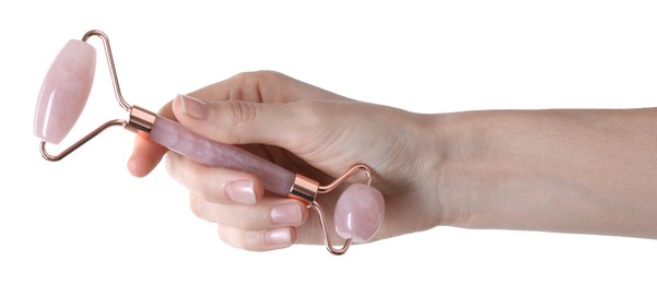 Woman holding face roller on white background, closeup