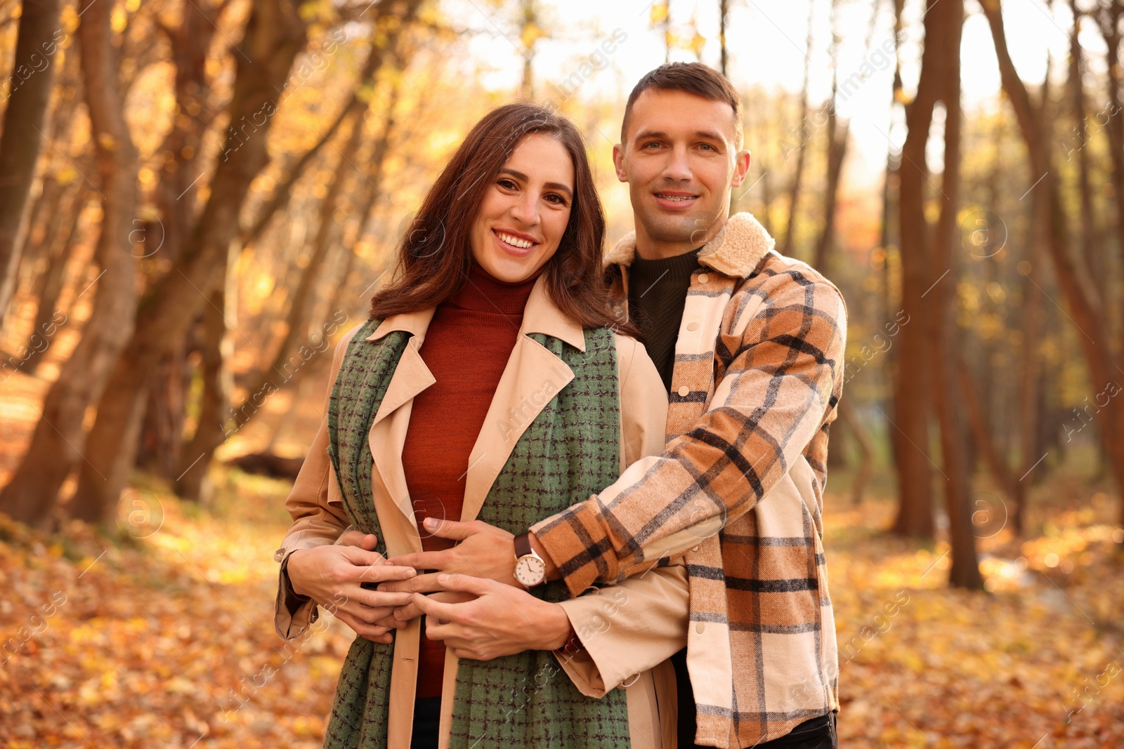 Photo of Happy couple spending time together in autumn park