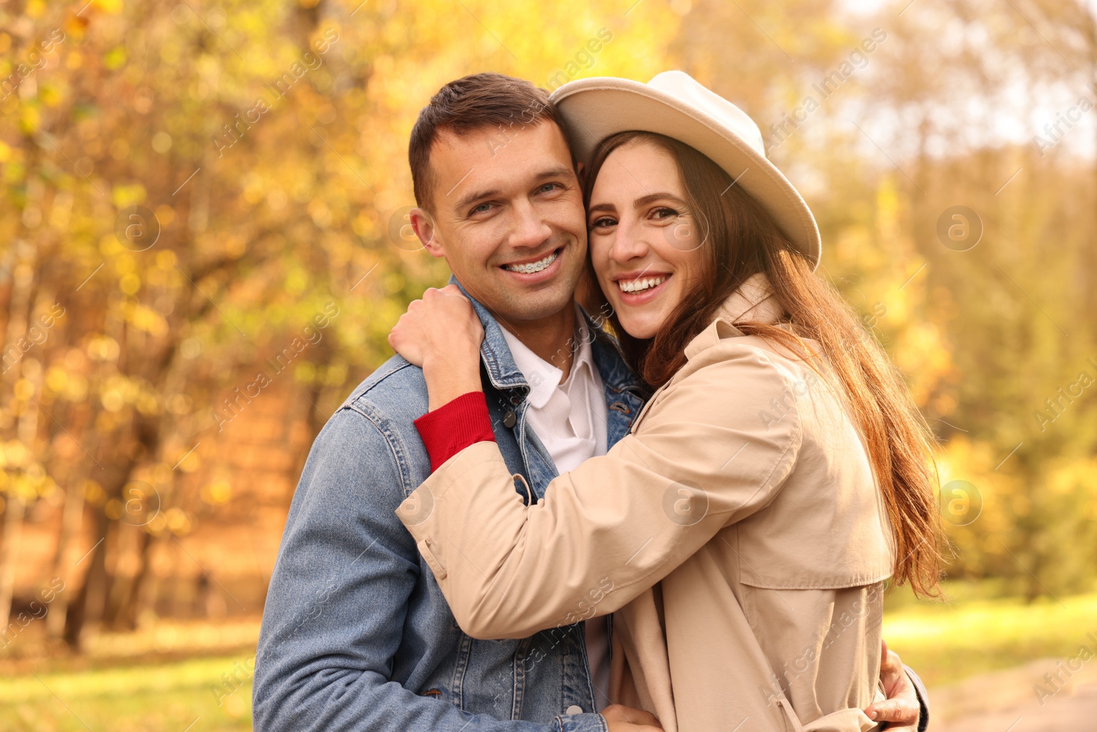 Photo of Happy couple spending time together in autumn park