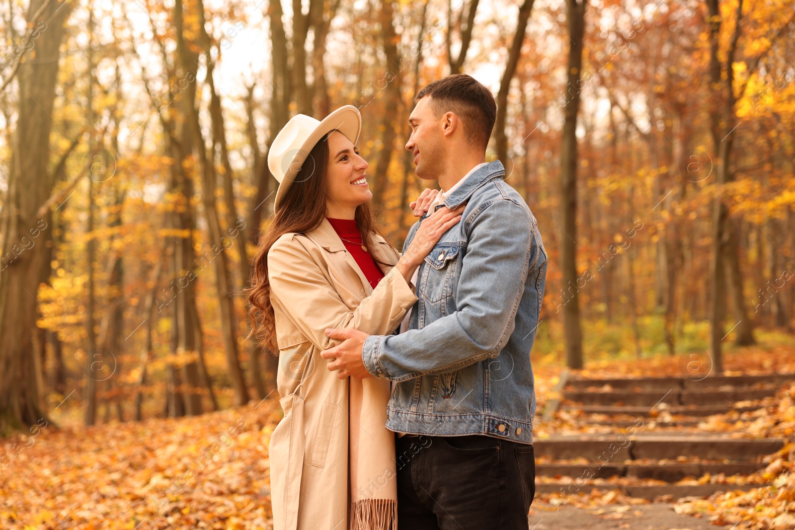 Photo of Happy couple spending time together in autumn park