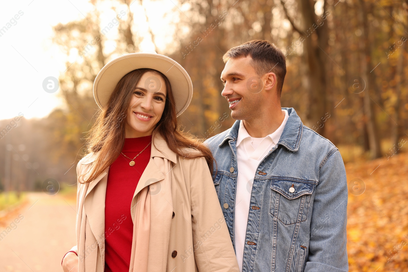 Photo of Happy couple spending time together in autumn park