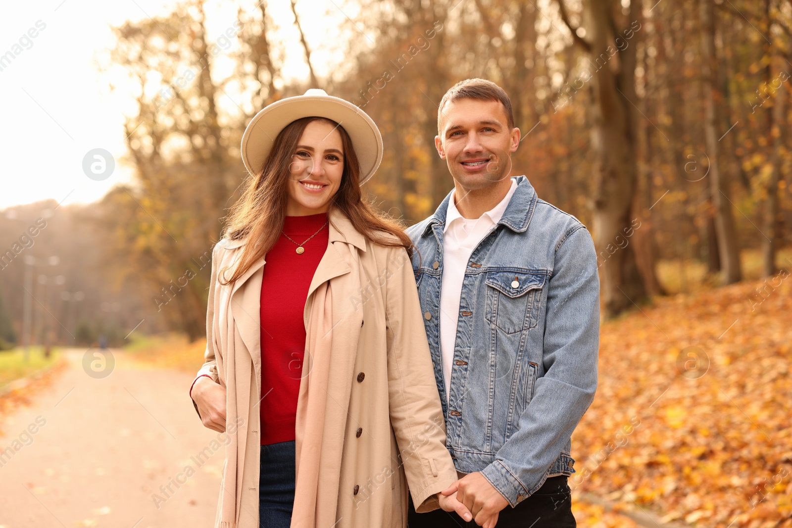 Photo of Happy couple spending time together in autumn park