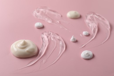 Photo of Samples of different cosmetic products on yellow background, closeup