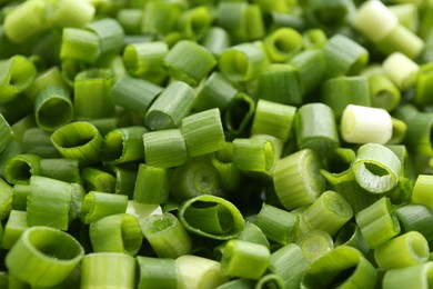 Photo of Chopped fresh green onion as background, closeup