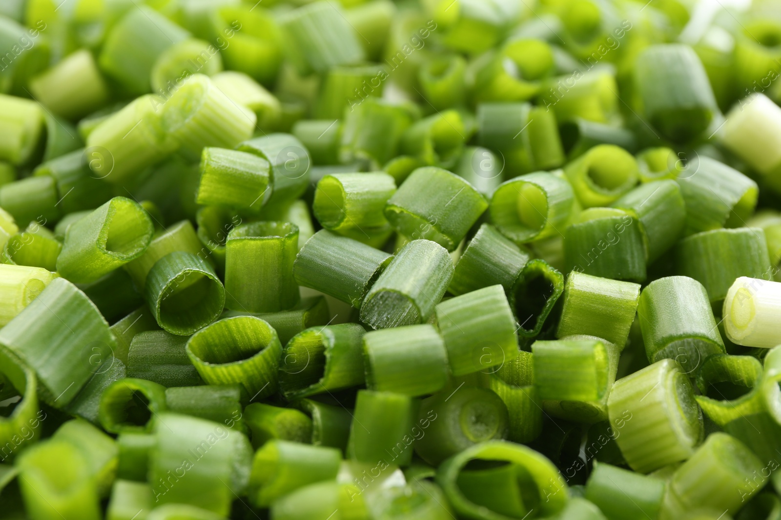 Photo of Chopped fresh green onion as background, closeup