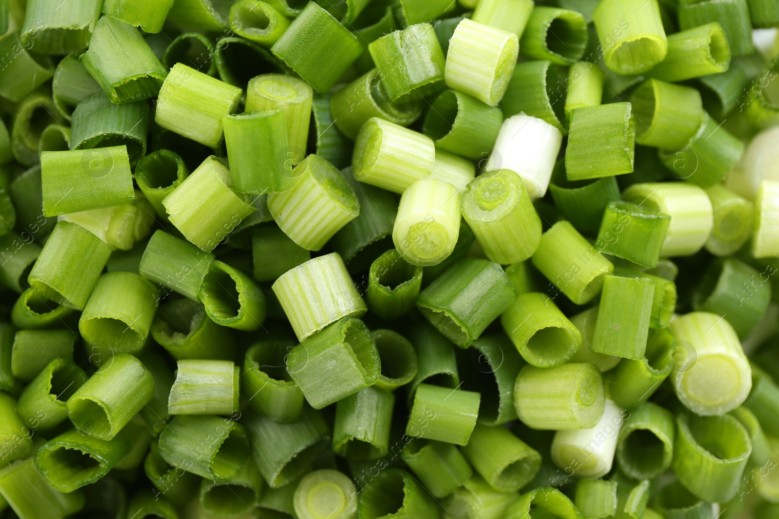 Photo of Chopped fresh green onion as background, closeup