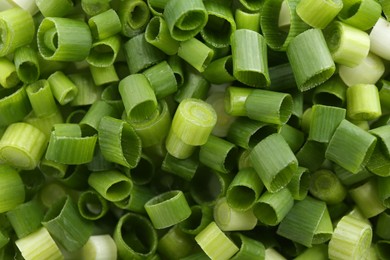 Photo of Chopped fresh green onion as background, closeup