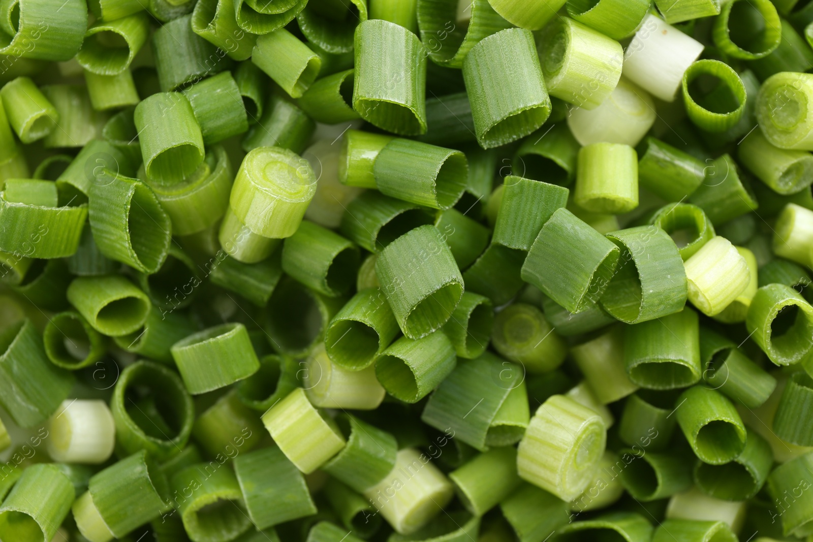 Photo of Chopped fresh green onion as background, closeup