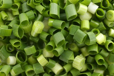 Photo of Chopped fresh green onion as background, closeup