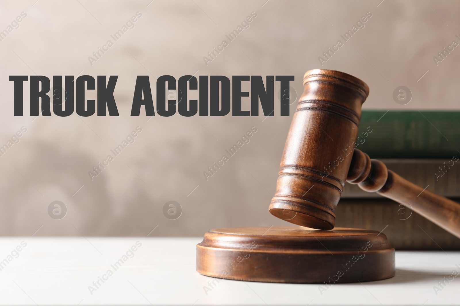 Image of Truck accident law. Wooden judge's gavel and books on table