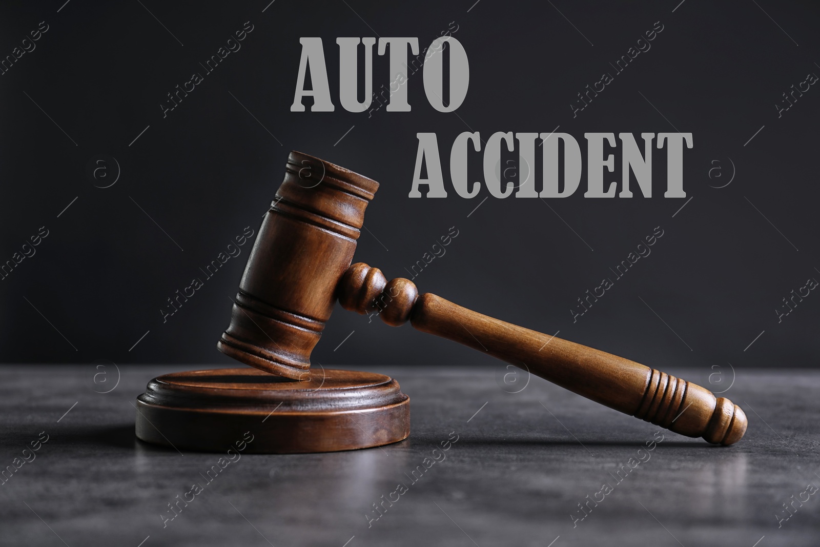 Image of Auto accident law. Judge's gavel on grey table