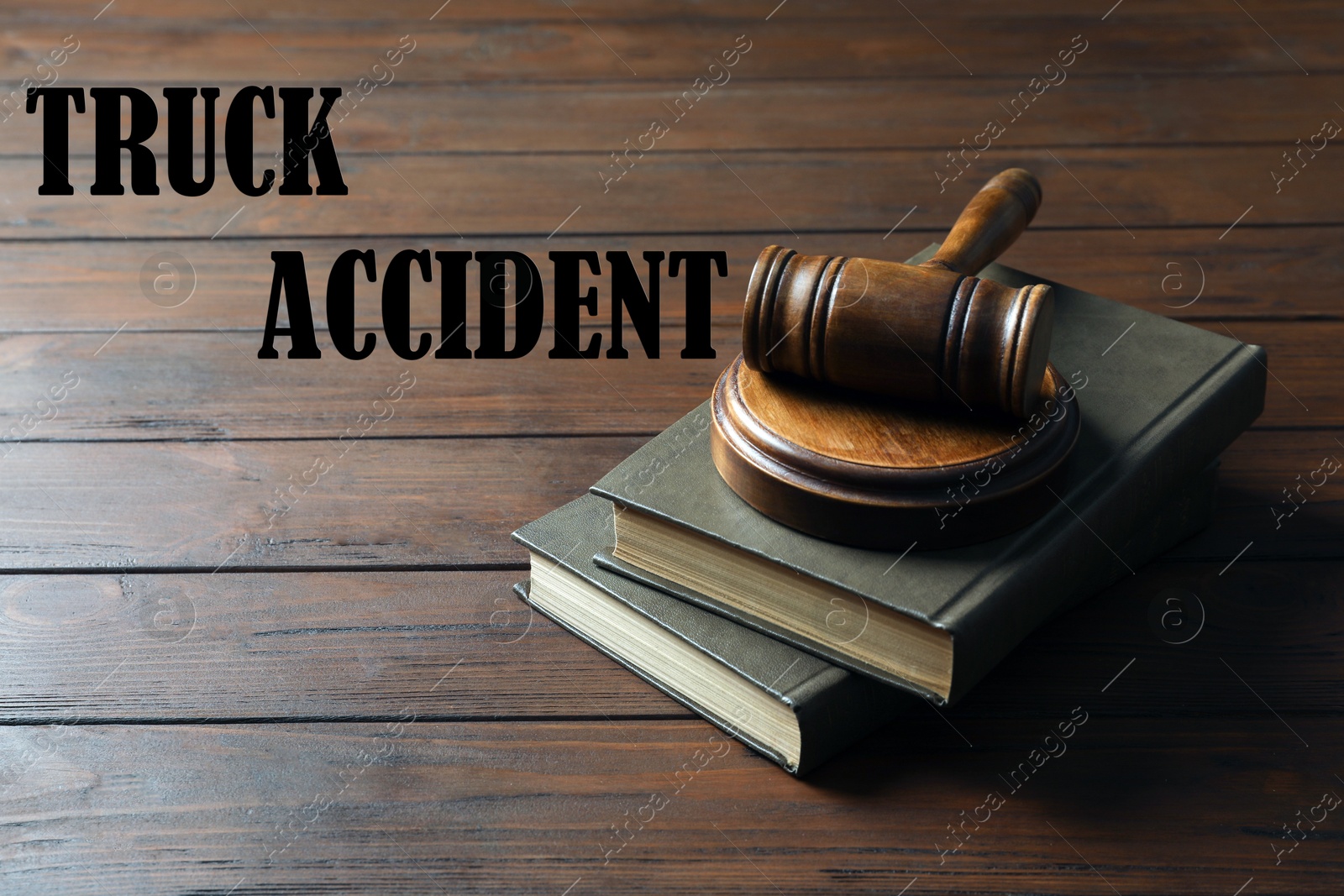 Image of Truck accident law. Judge's gavel and books on wooden table