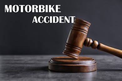 Image of Motorbike accident law. Judge's gavel on grey table