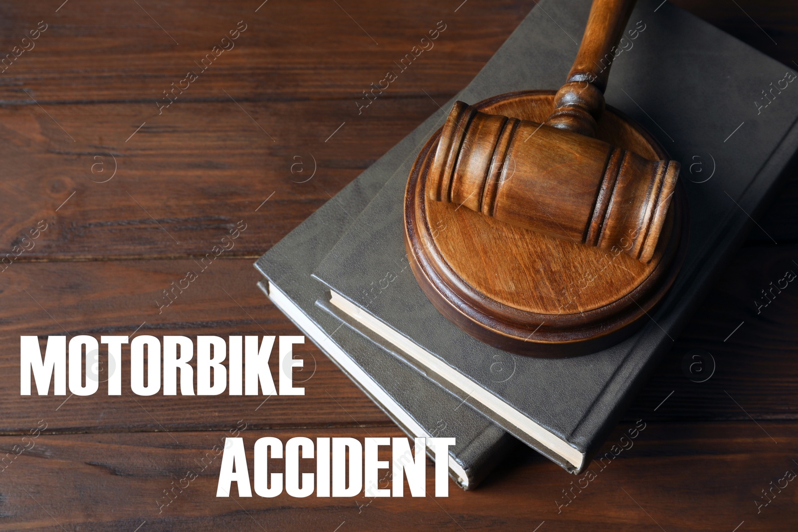 Image of Motorbike accident law. Judge's gavel and books on wooden table