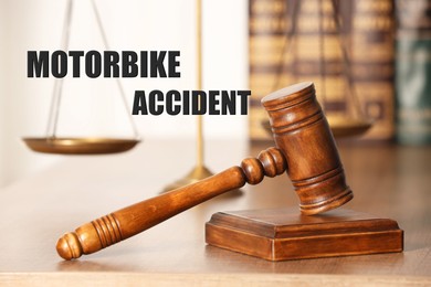 Image of Motorbike accident law. Judge's gavel on wooden table