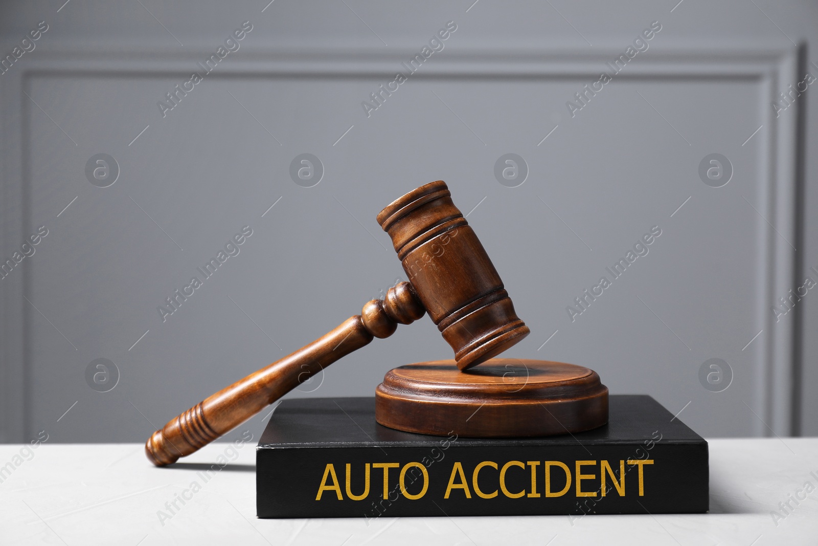 Image of Auto Accident law book and judge's gavel on light table