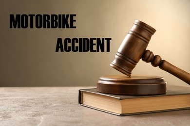 Image of Motorbike accident law. Wooden judge's gavel and book on table