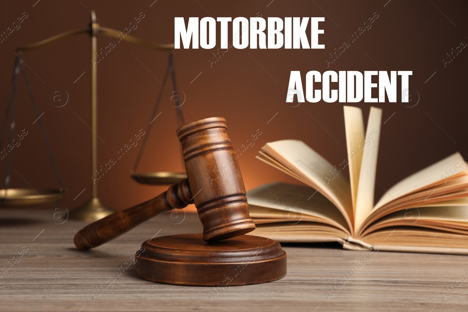 Image of Motorbike accident law. Judge's gavel, scales of justice and book on wooden table against brown background