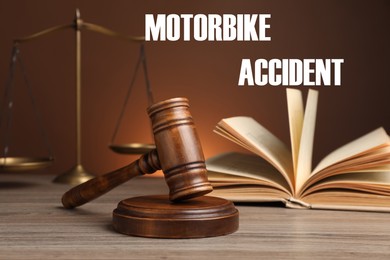 Image of Motorbike accident law. Judge's gavel, scales of justice and book on wooden table against brown background