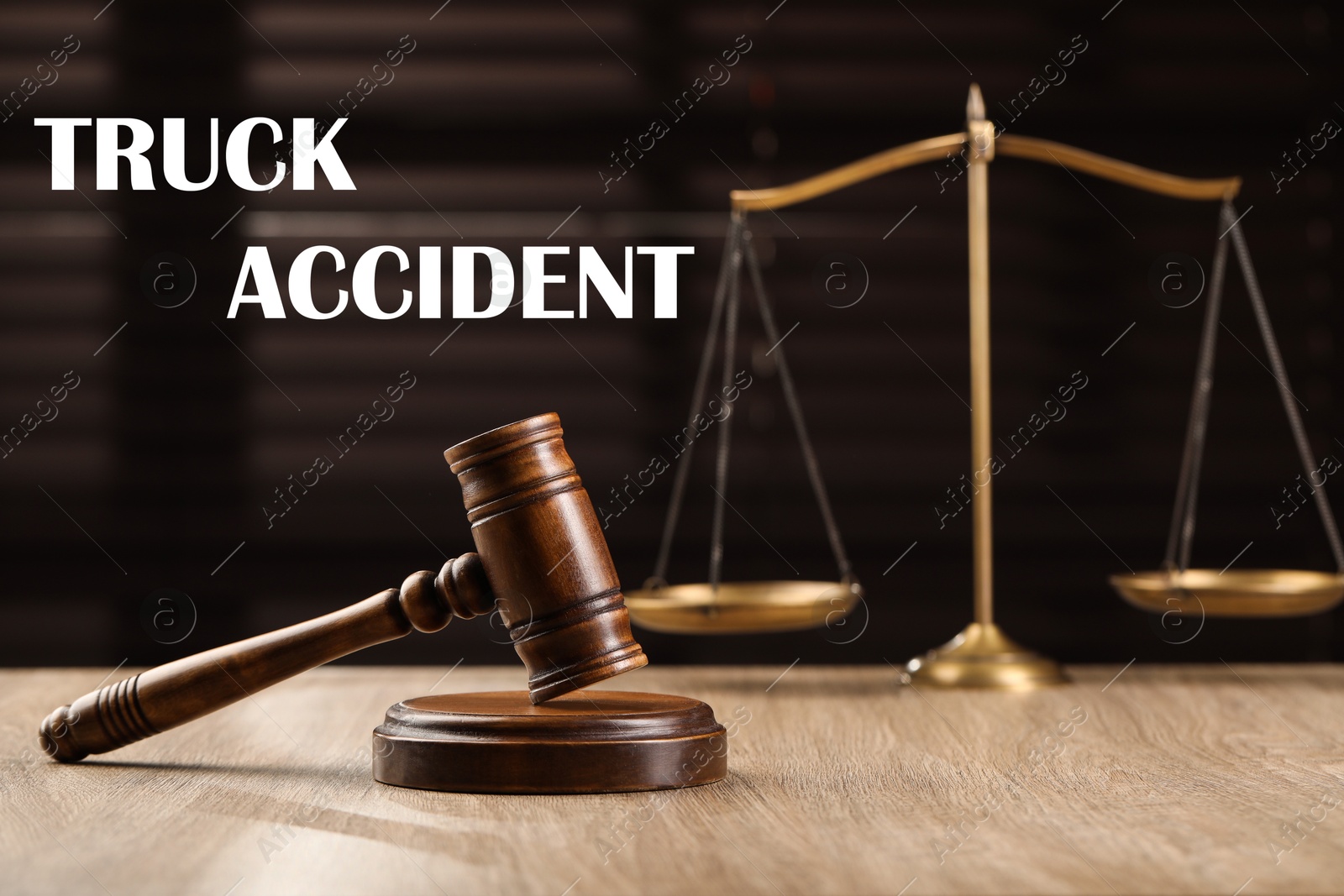 Image of Truck accident law. Wooden judge's gavel and scales of justice on table