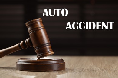 Image of Auto accident law. Wooden judge's gavel on table