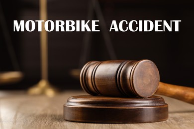 Image of Motorbike accident law. Wooden judge's gavel on table