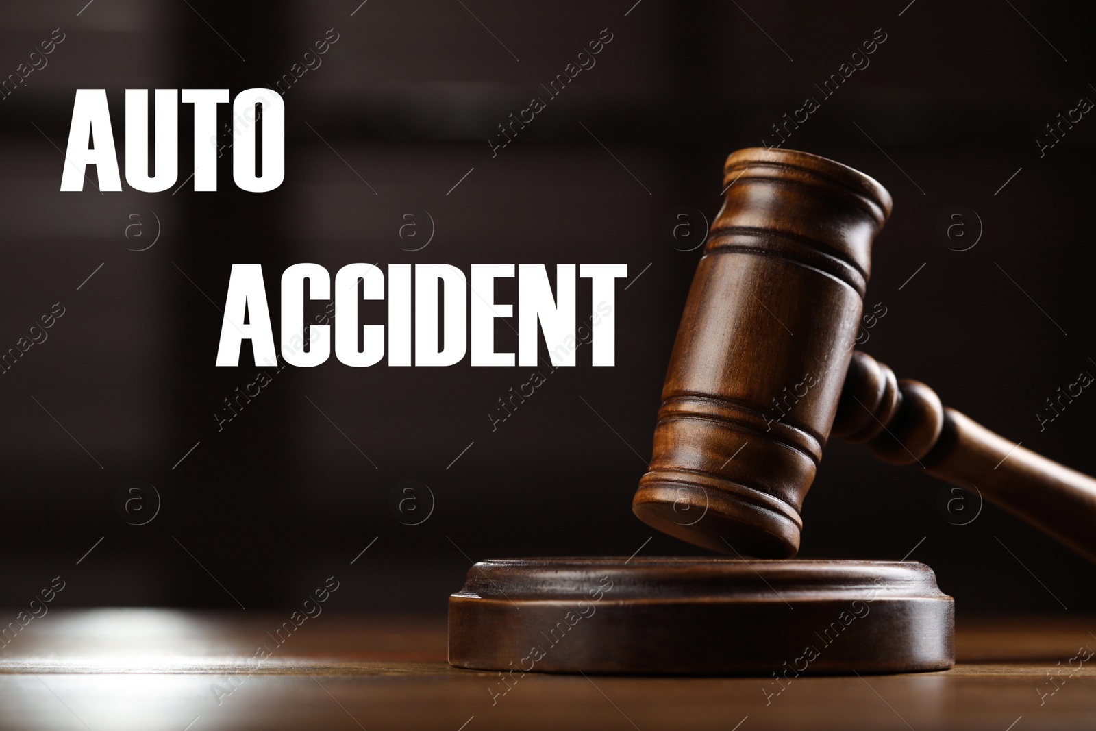 Image of Auto accident law. Wooden judge's gavel on table