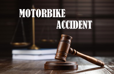 Image of Motorbike accident law. Wooden judge's gavel, scales of justice and books on table