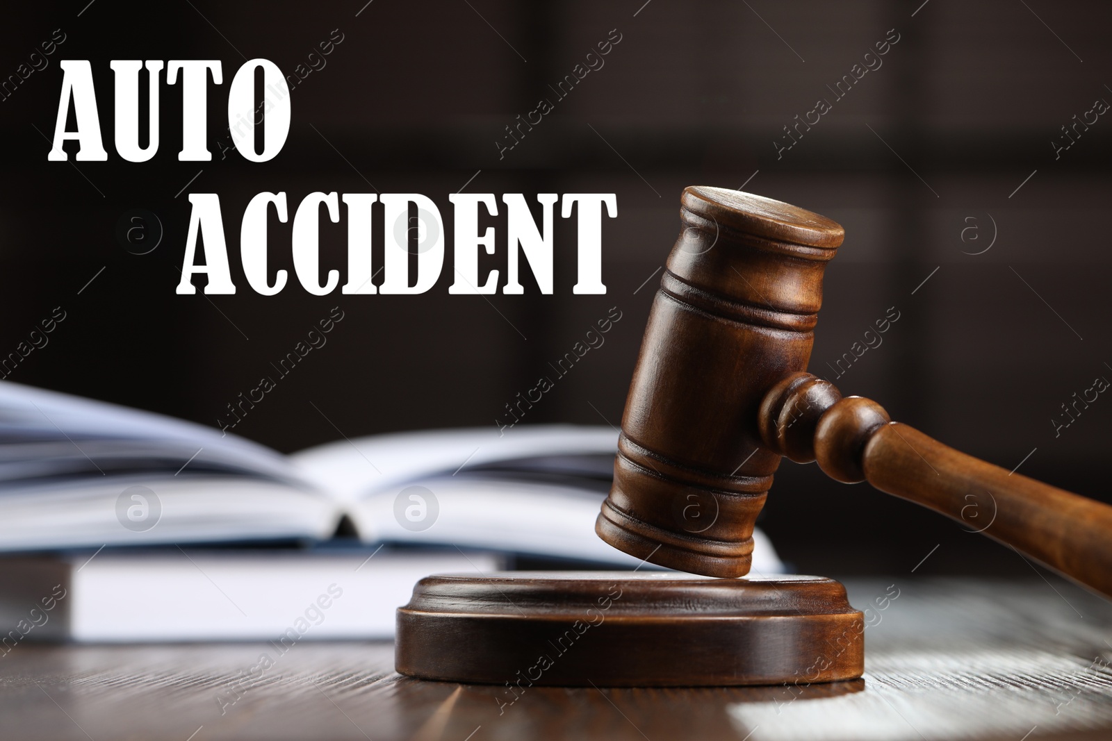 Image of Auto accident law. Wooden judge's gavel and books on table